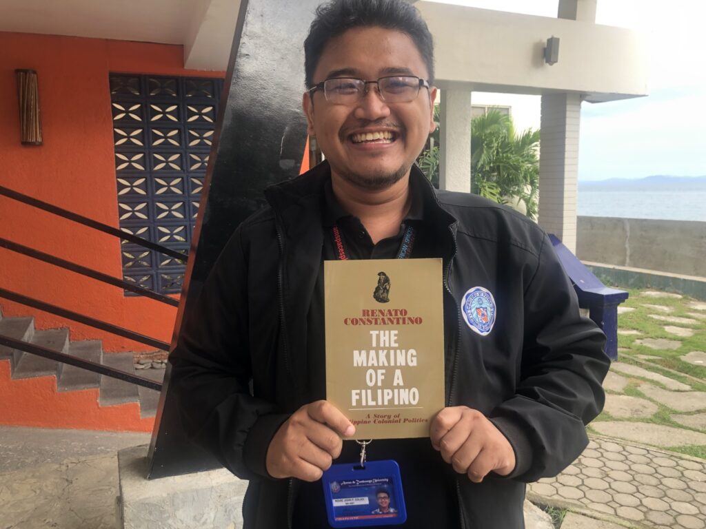 A faculty member from the Ateneo de Zamboanga University beams as he holds The Making of a Filipino, a book by Renato Constantino. The Constantino Foundation donated a full set of publications to ADZU in July 2023. Photo © Ateneo Zamboanga-Mindanao Institute
